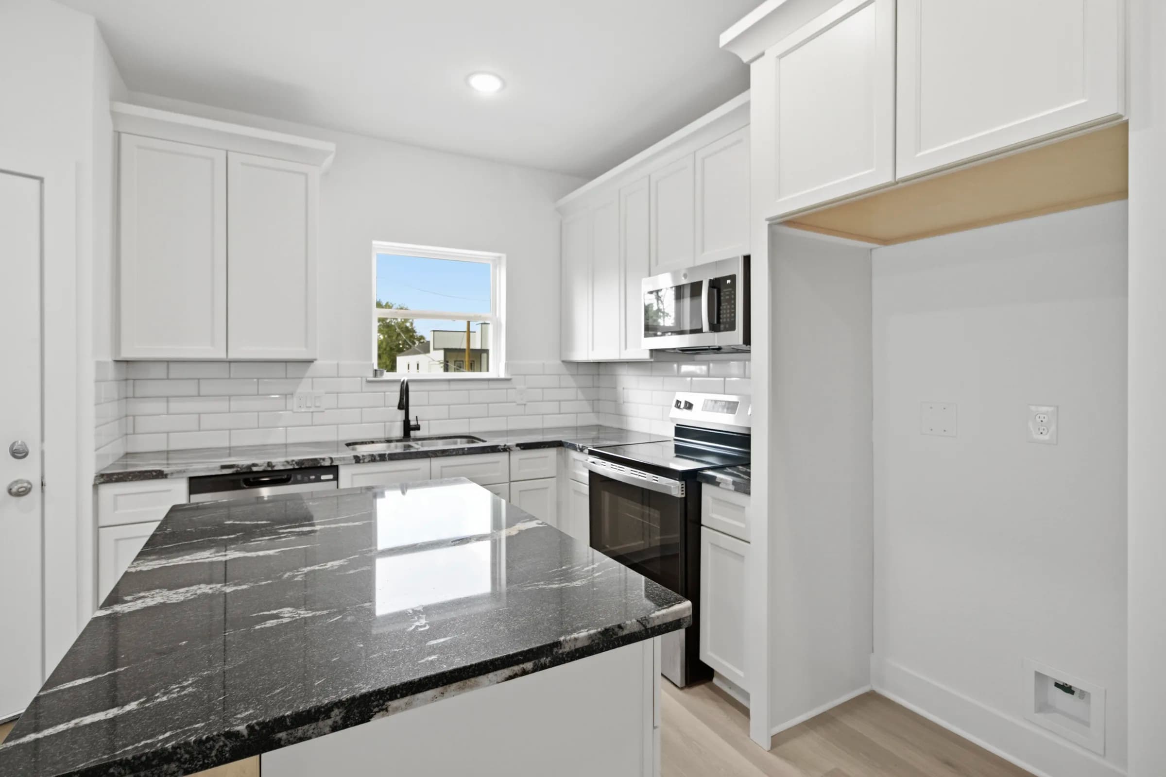 Kitchen with subway tile backsplash