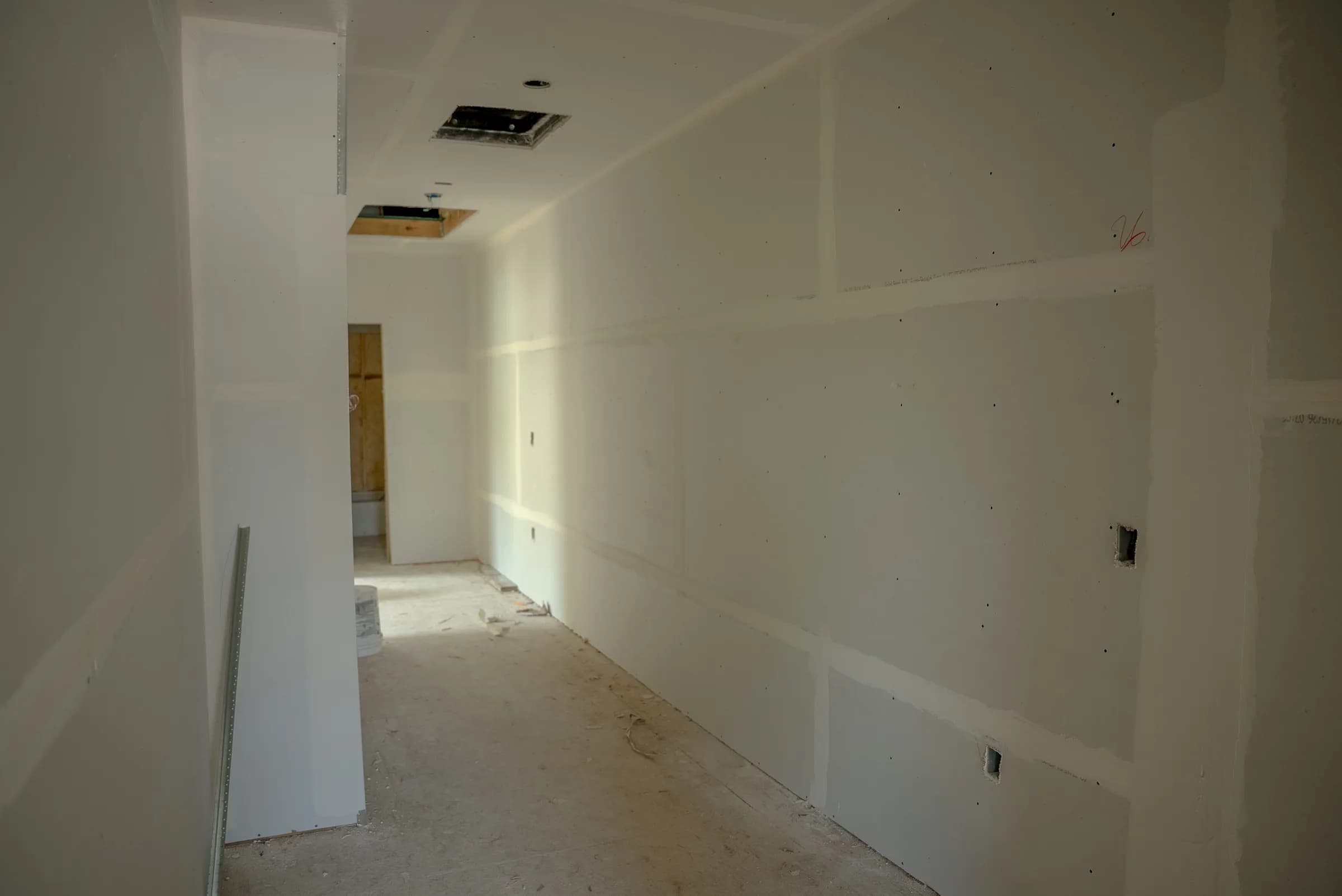 Hallway with drywall complete