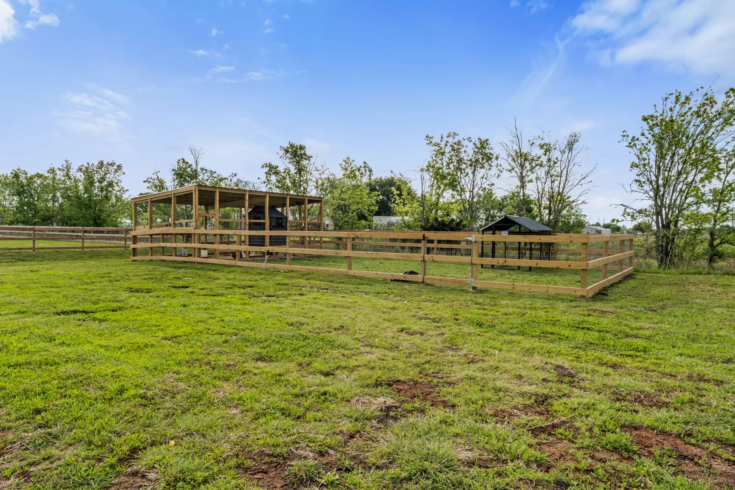 Fenced pen and barn